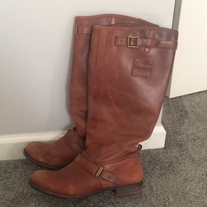 Tall brown leather boots